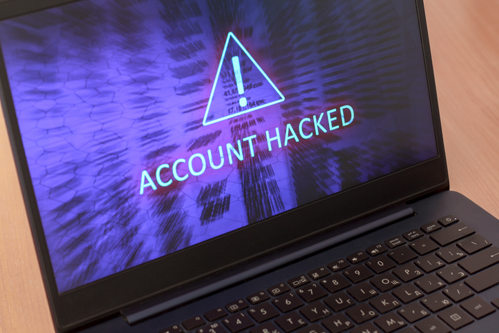 image of a computer screen with a account hacked notice on it. 